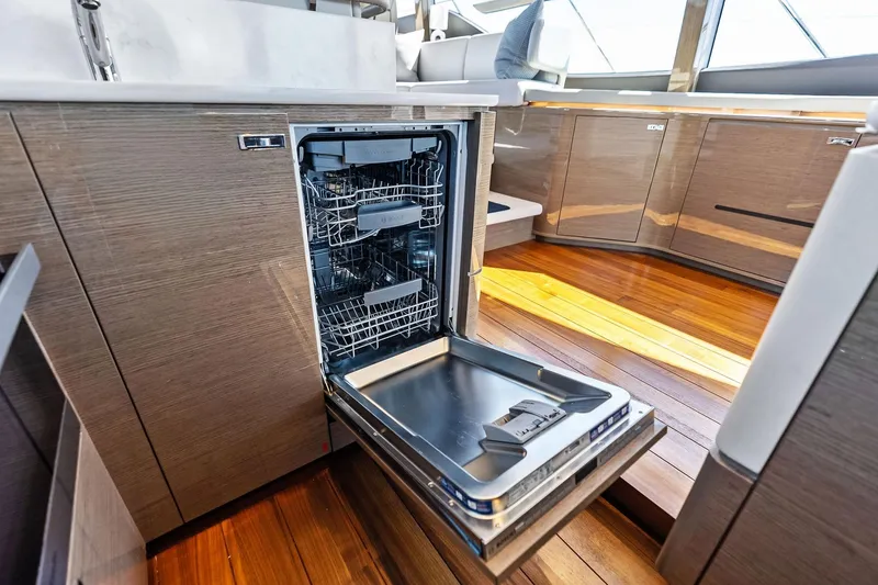 Slide: The Image of Open dishwasher in modern kitchen of 2022 Princess 55 Flybridge yacht. - 78