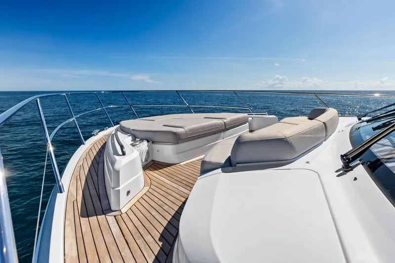 Slide: The Image of Luxurious 2022 Princess 55 Flybridge yacht deck with sun loungers, ocean view. - 86