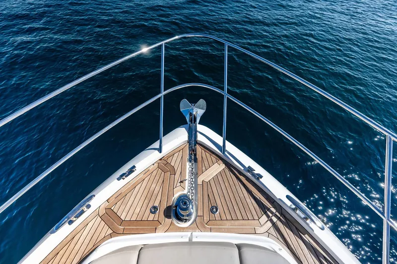 Slide: The Image of Bow view of 2022 Princess 55 Flybridge yacht on open water. - 88