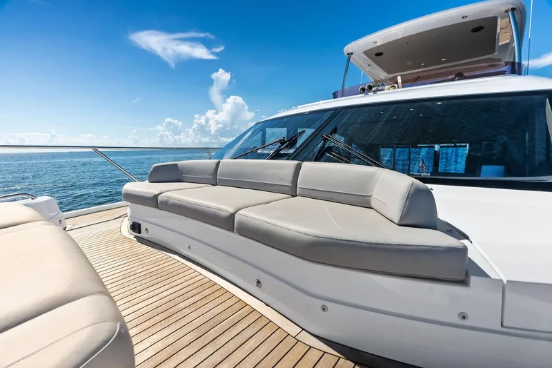 Slide: The Image of Luxurious 2022 Princess 55 flybridge yacht with elegant deck seating and ocean view. - 90