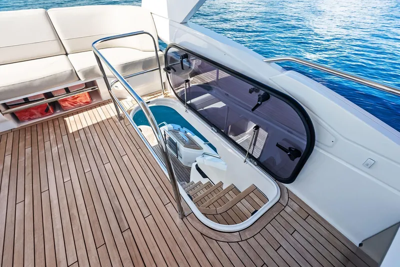 Slide: The Image of Luxurious 2022 Princess 55 Flybridge yacht with elegant teak deck and ocean view. - 93