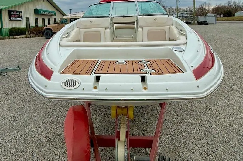 Slide: The Image of 2012 Crownline Eclipse E2 boat on trailer, rear view with seating and deck. - 3