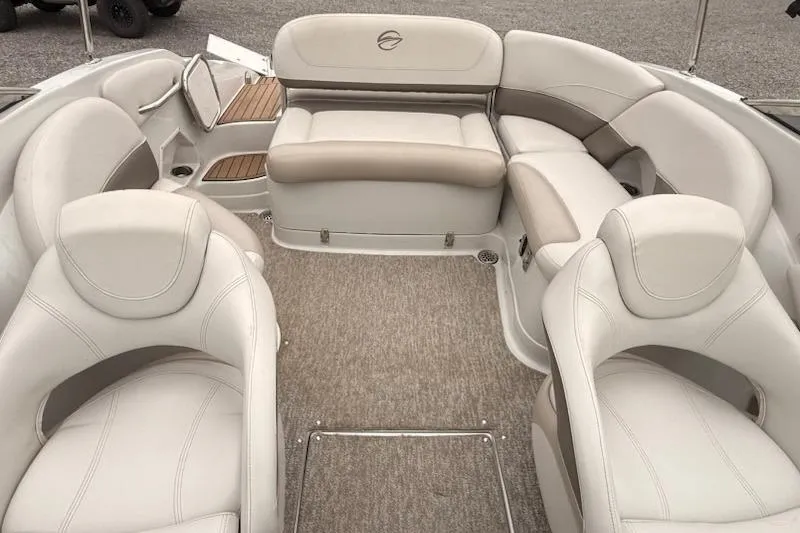 Slide: The Image of 2012 Crownline Eclipse E2 boat interior with beige and gray seating arrangement. - 7
