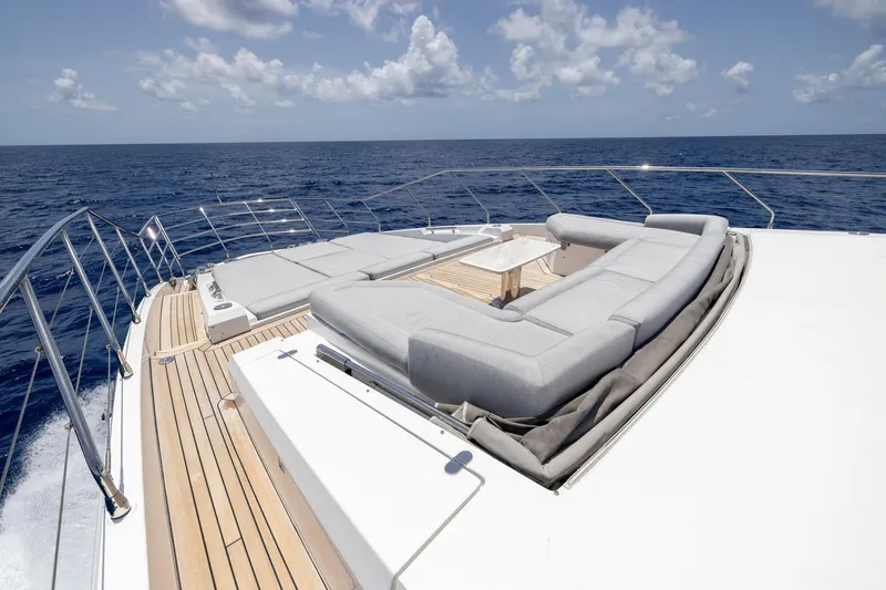 Slide: The Image of Luxurious Azimut Grande 27 METRI yacht deck with elegant seating, 2021 model, ocean view. - 4