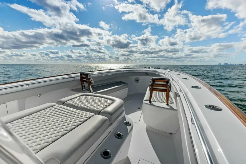 Slide: The Image of 2021 Valhalla Boatworks V-37 on open water, featuring luxurious seating and ocean view. - 12
