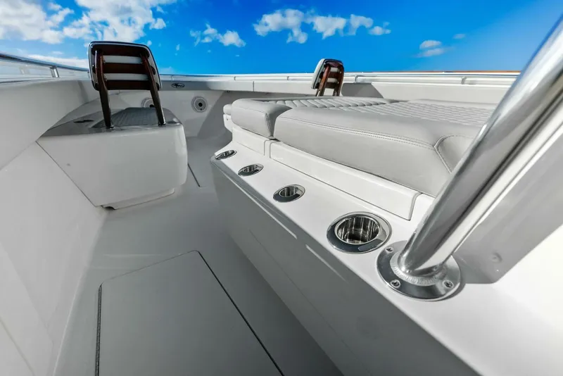Slide: The Image of 2021 Valhalla Boatworks V-37 interior with seating, rod holders, and clear blue sky. - 13
