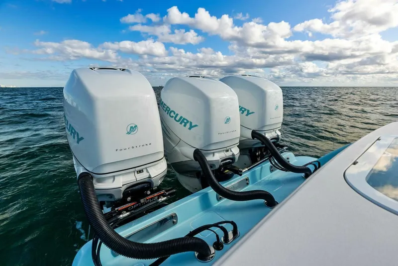 Slide: The Image of Triple Mercury outboard engines on a 2021 Valhalla Boatworks V-37, cruising on open water. - 27