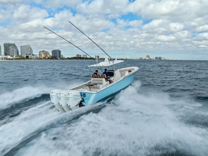 Slide: The Image of 2021 Valhalla Boatworks V-37 cruising on ocean with city skyline in background. - 38