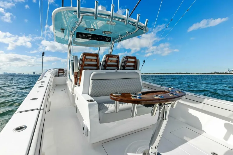 Slide: The Image of 2021 Valhalla Boatworks V-37 on open water, featuring sleek design and luxurious seating. - 4