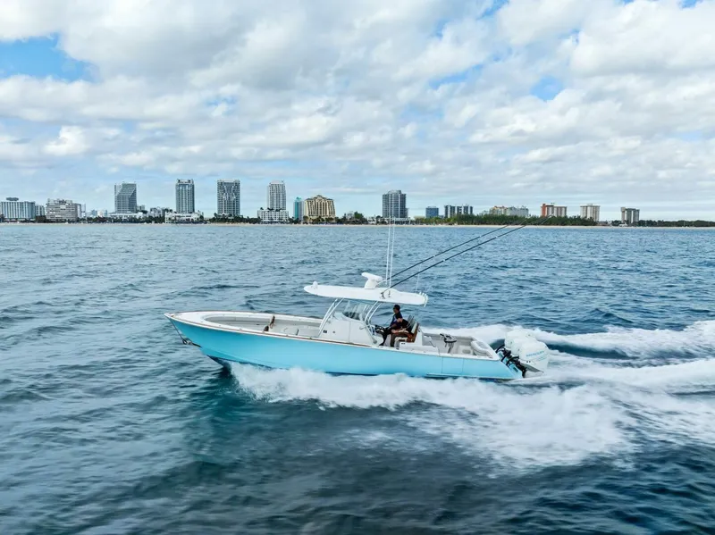 Slide: The Image of 2021 Valhalla Boatworks V-37 cruising on ocean with city skyline in background. - 41