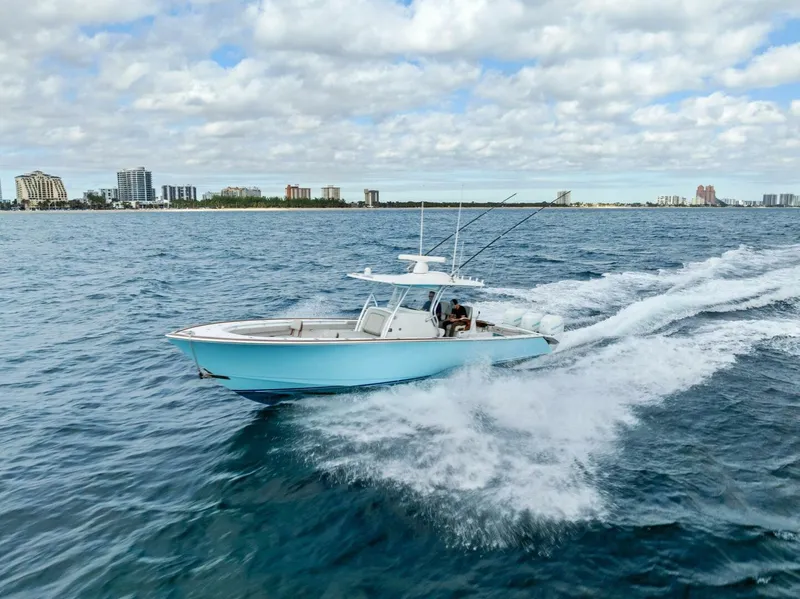 Slide: The Image of 2021 Valhalla Boatworks V-37 cruising on open water under a cloudy sky. - 42