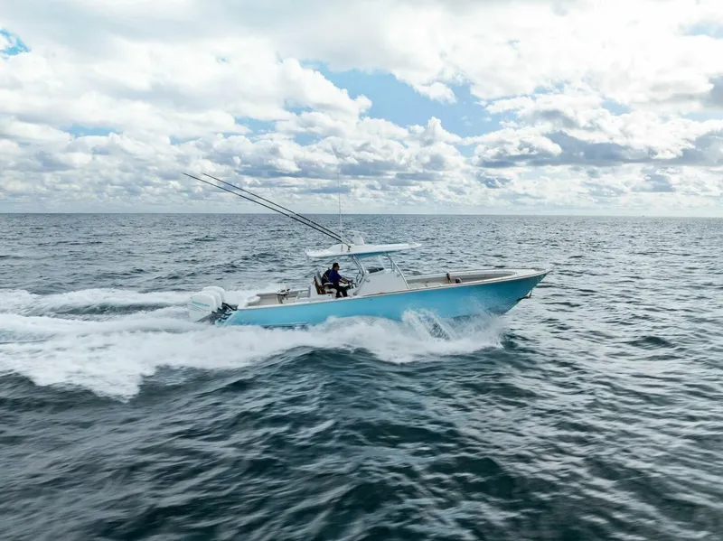 Slide: The Image of 2021 Valhalla Boatworks V-37 cruising on open ocean under cloudy sky. - 44