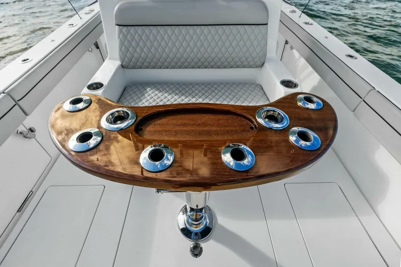 Slide: The Image of 2021 Valhalla Boatworks V-37 with elegant wood finish and seating, showcasing luxury marine design. - 5
