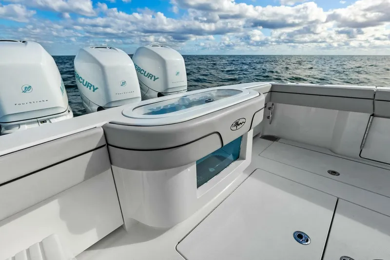 Slide: The Image of 2021 Valhalla Boatworks V-37 with Mercury engines, ocean view, and sleek deck design. - 6