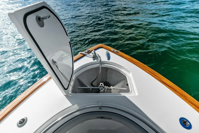 Slide: The Image of 2021 Valhalla Boatworks V-37 anchor compartment open on calm water. - 8