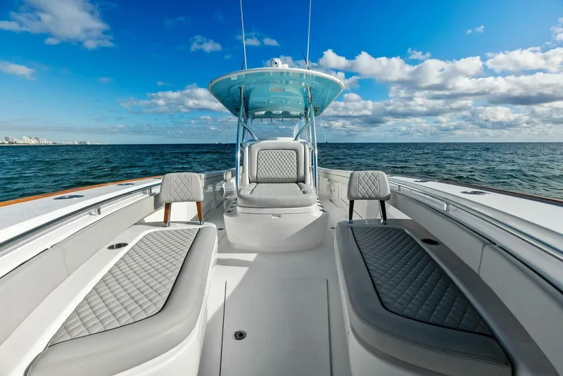 Slide: The Image of 2021 Valhalla Boatworks V-37 on open water, featuring luxurious seating and clear blue skies. - 9