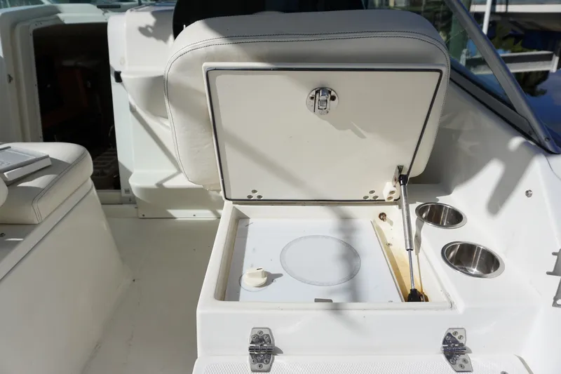 Slide: The Image of 2008 Hydra-Sports Vector 2900 VX boat interior with open storage compartment and cup holders. - 11