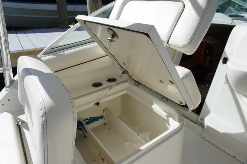 Slide: The Image of 2008 Hydra-Sports Vector 2900 VX boat with open storage compartment and white seating. - 13