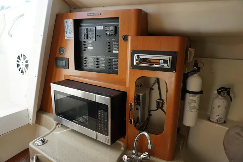 Slide: The Image of 2008 Hydra-Sports Vector 2900 VX interior with control panel, microwave, and fire extinguisher. - 16