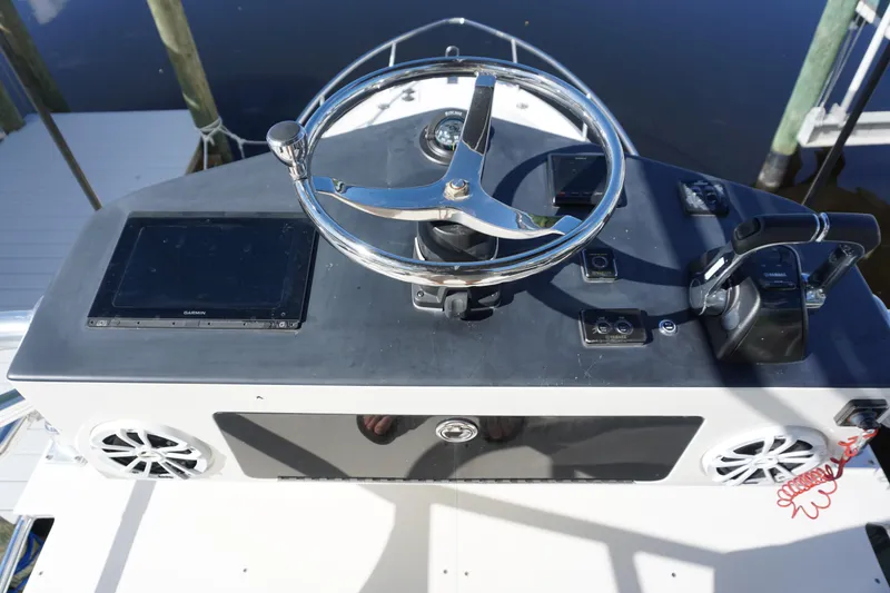 Slide: The Image of 2008 Hydra-Sports Vector 2900 VX helm with steering wheel and navigation controls. - 21