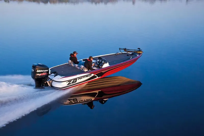 Slide: The Image of Manufacturer Provided Image: 2013 Nitro Z-8 boat speeding on calm water, creating a clear reflection. - 11