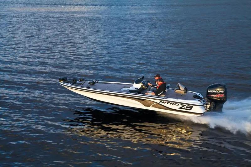 Slide: The Image of Manufacturer Provided Image: 2013 Nitro Z-8 boat speeding on open water, featuring Mercury engine. - 9