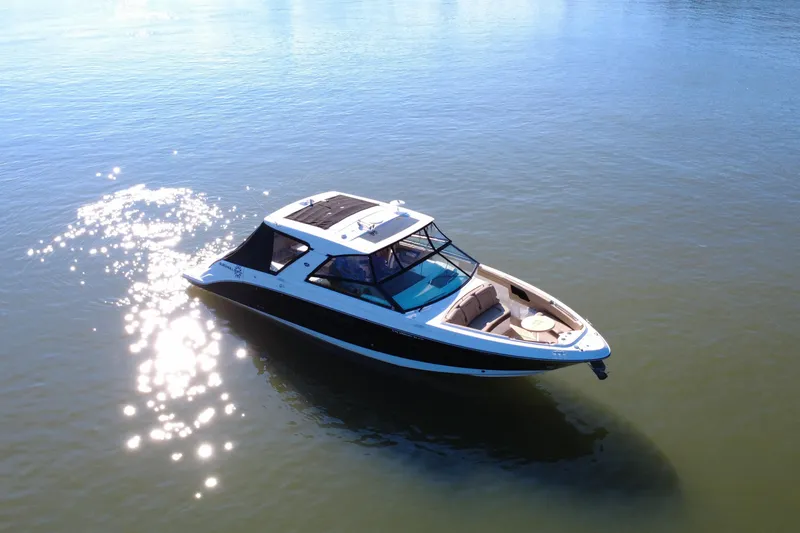 Slide: The Image of 2022 Sea Ray SLX 400 boat cruising on calm water under sunlight. - 22