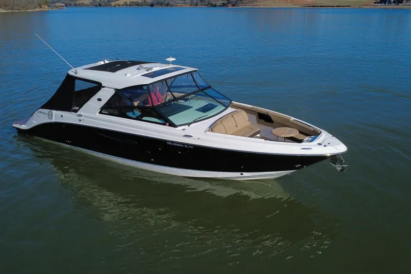 Slide: The Image of 2022 Sea Ray SLX 400 boat on calm water, featuring sleek design and spacious seating. - 23