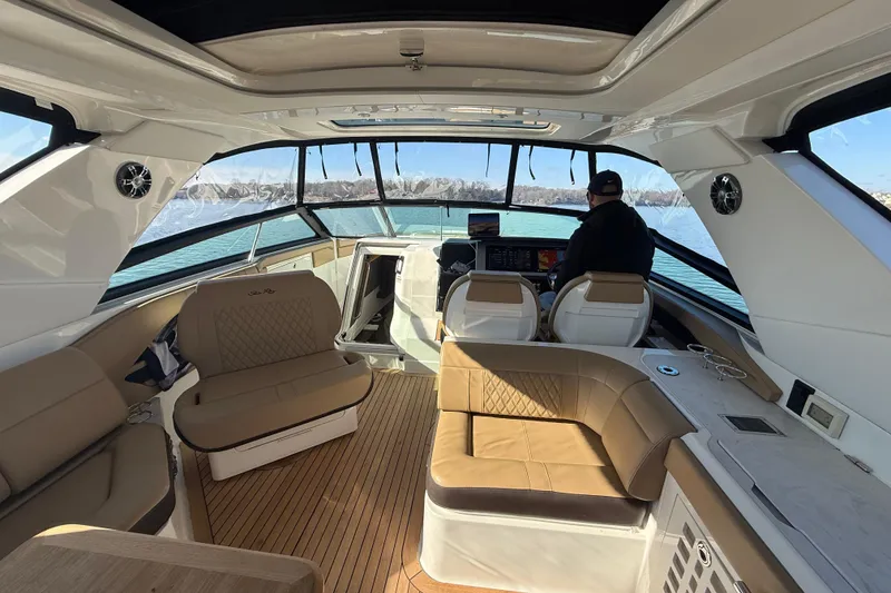 Slide: The Image of Luxurious 2022 Sea Ray SLX 400 boat interior with spacious seating and modern helm. - 41