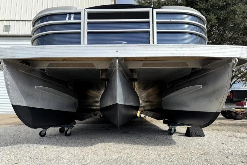 Slide: The Image of 2023 Bennington 22SSR pontoon boat, underside view, showcasing triple-tube design. - 8