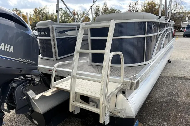 Slide: The Image of 2023 Bennington 22SSR pontoon boat with Yamaha outboard motor, docked outdoors. - 9