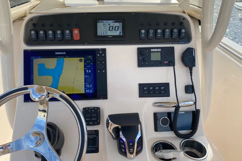 Slide: The Image of Control panel of 2025 Grady-White Fisherman 236 boat with navigation and communication systems. - 12