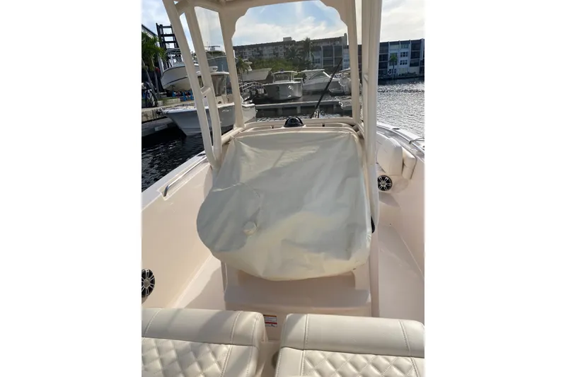 Slide: The Image of 2025 Grady-White Fisherman 236 boat interior with cushioned seating and sleek design. - 14