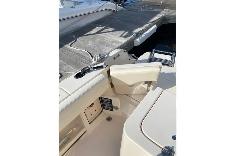 Slide: The Image of 2025 Grady-White Fisherman 236 boat stern with motor and swim platform. - 18