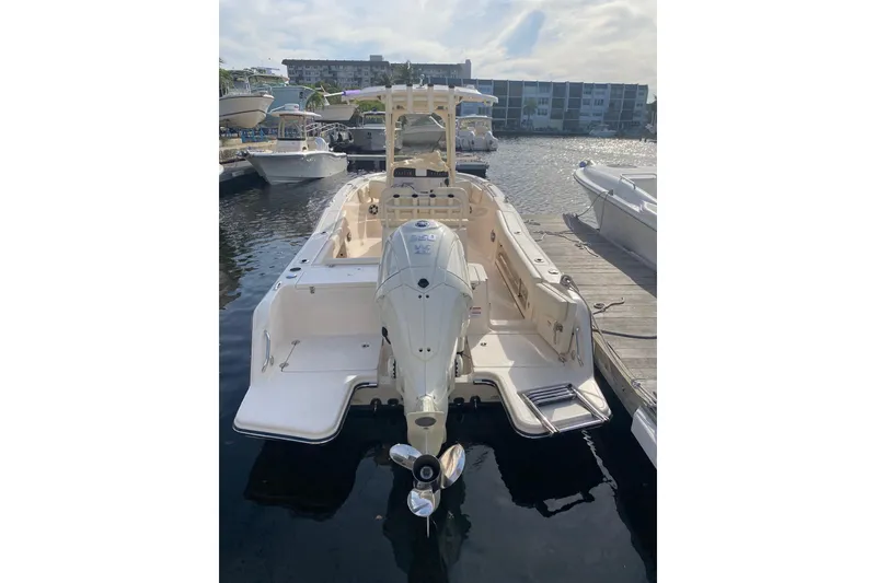 Slide: The Image of 2025 Grady-White Fisherman 236 boat docked at marina, rear view. - 4