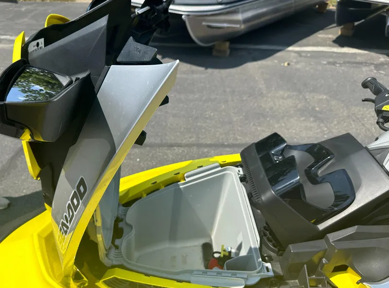 Slide: The Image of 2015 Sea-Doo RXT260 with open storage compartment, yellow and black design. - 11