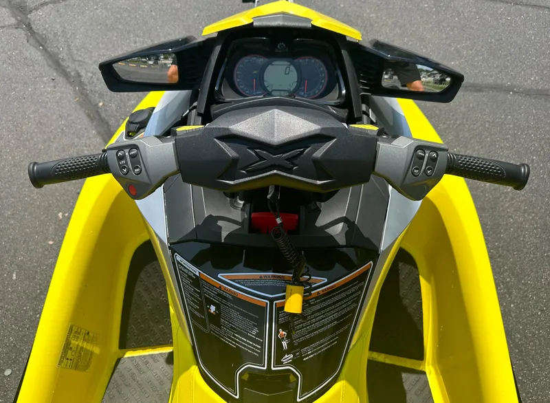 Slide: The Image of 2015 Sea-Doo RXT260 handlebars and dashboard, featuring a vibrant yellow design. - 13