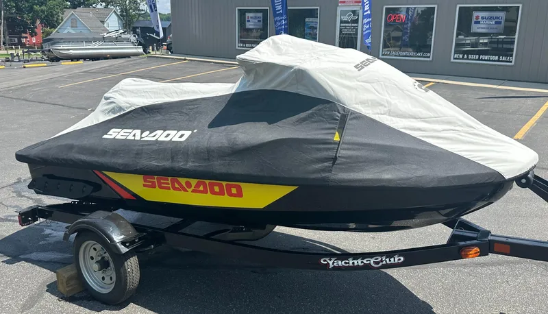 Slide: The Image of 2015 Sea-Doo RXT260 jet ski covered on trailer in parking lot. - 7