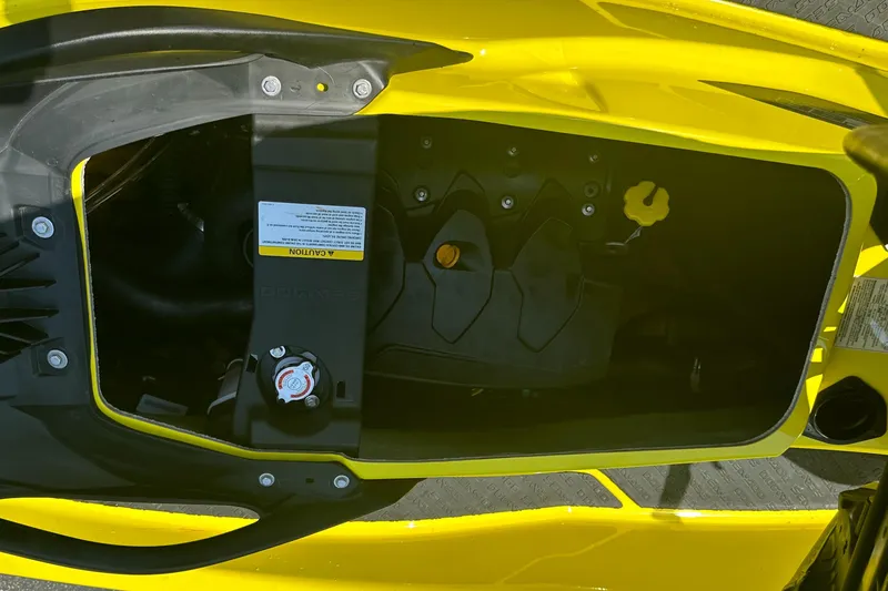 Slide: The Image of 2015 Sea-Doo RXT260 engine compartment, showcasing internal components and yellow exterior. - 9