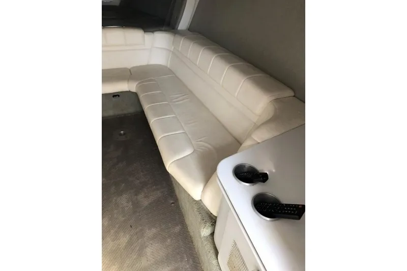 Slide: The Image of Interior of 1998 Formula 382 FASTech boat with white leather seating and cup holders. - 13