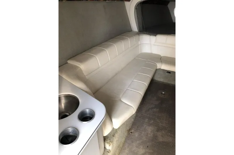 Slide: The Image of Interior of 1998 Formula 382 FASTech boat with white leather seating and cup holders. - 14