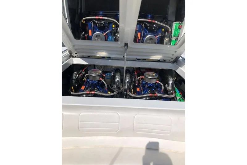 Slide: The Image of 1998 Formula 382 FASTech boat engine compartment with dual engines visible. - 16