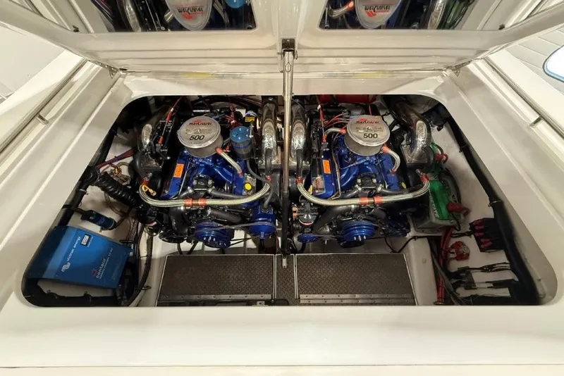 Slide: The Image of Twin Mercury engines in a 1998 Formula 382 FASTech boat engine compartment. - 22