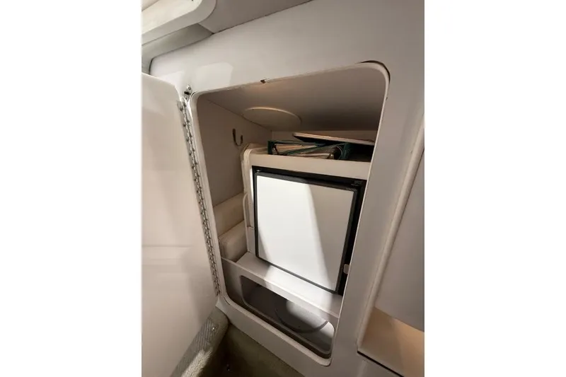 Slide: The Image of 1998 Formula 382 FASTech cabin storage with compact refrigerator. - 25