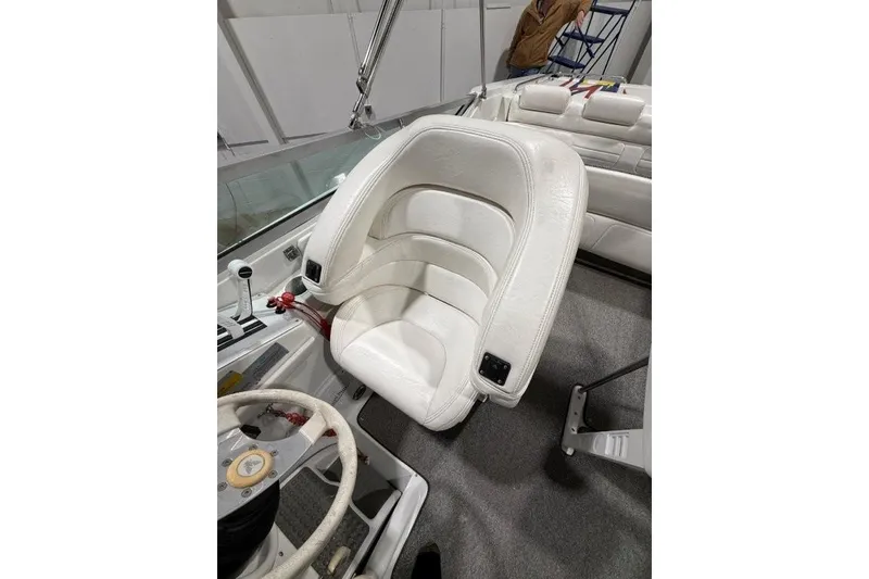 Slide: The Image of White leather seat in a 1998 Formula 382 FASTech boat cockpit. - 28