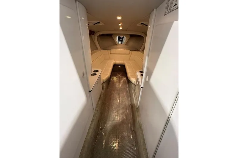 Slide: The Image of Interior of a 1998 Formula 382 FASTech boat, featuring beige seating and sleek design. - 7