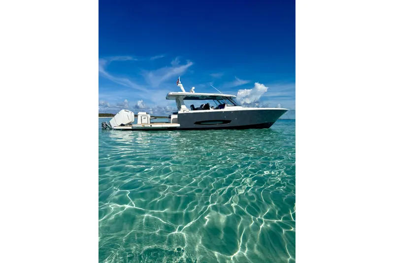 Slide: The Image of 2026 Regal 50 SAV yacht on clear turquoise water under a bright blue sky. - 22