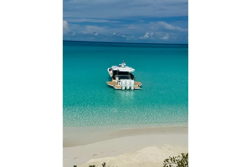 Slide: The Image of Luxury Regal 50 SAV yacht anchored in crystal-clear turquoise waters, 2026 model. - 33