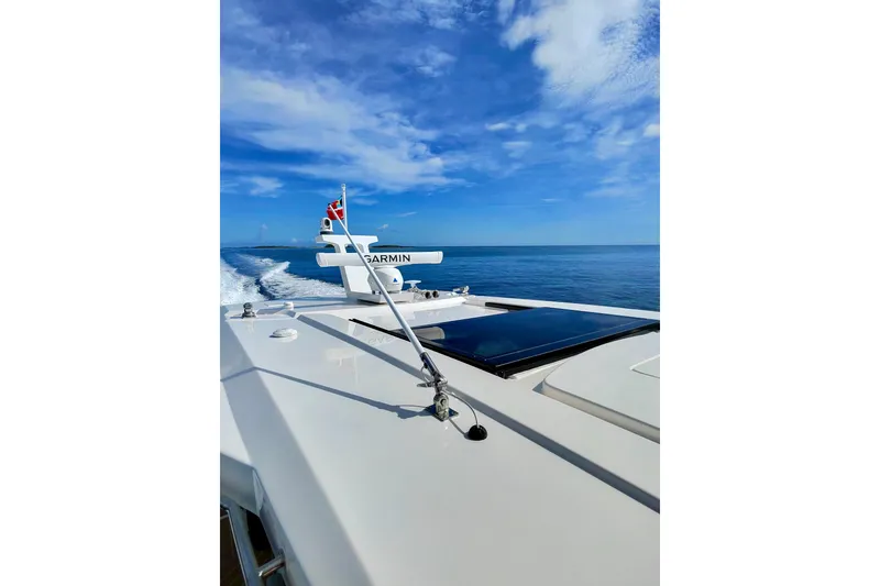 Slide: The Image of 2026 Regal 50 SAV yacht cruising on open sea under clear blue sky. - 39
