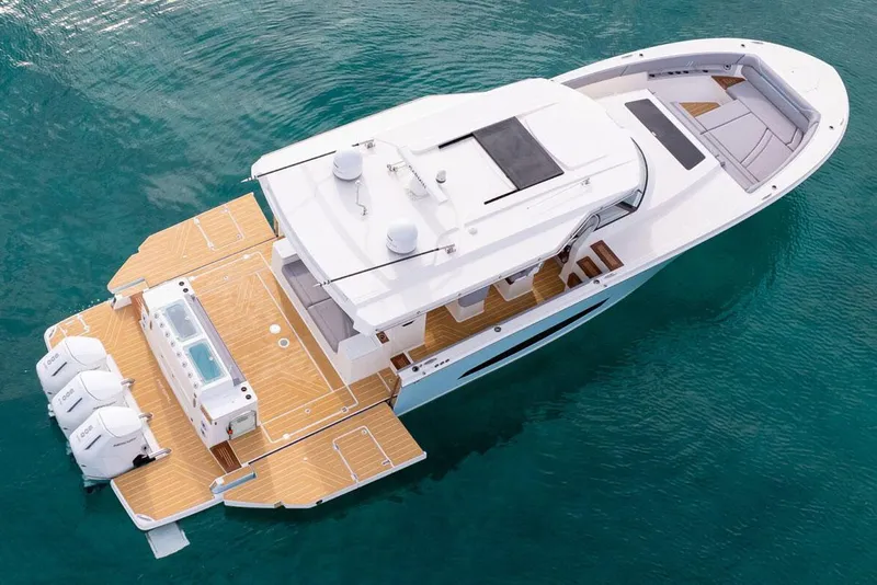The Image of Manufacturer Provided Image: 2026 Regal 50 SAV luxury yacht on clear blue water, aerial view. - 5